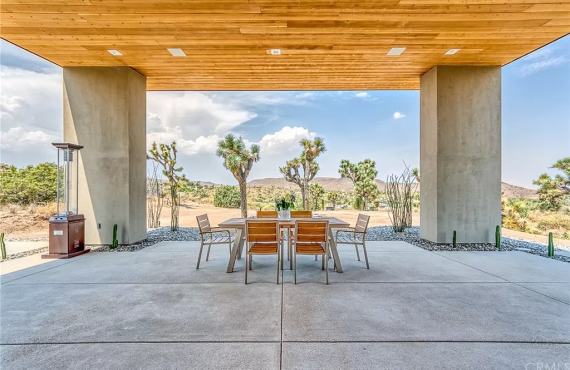 A table and chairs in an outdoor setting.