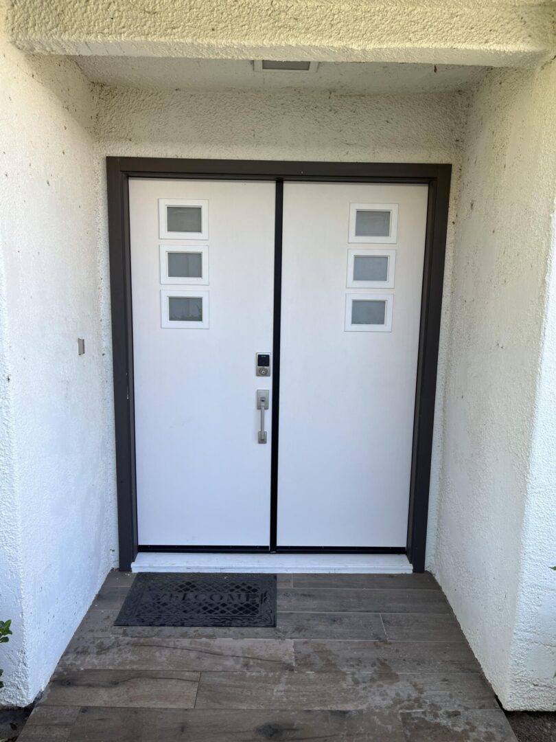 A white door with two windows on the outside.